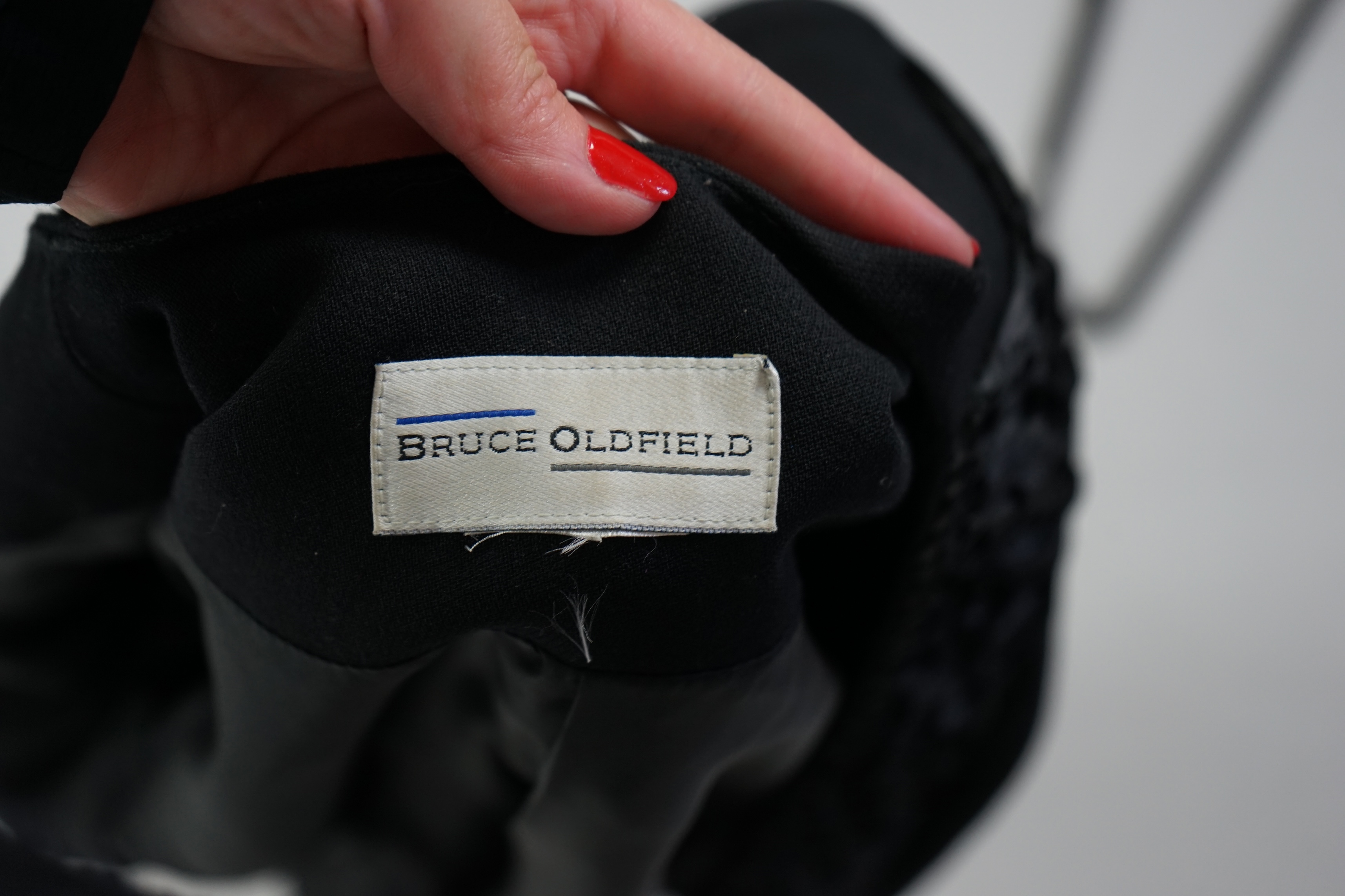 A Bruce Oldfield black evening dress and black bolero style jacket. Size 12-14 Proceeds to Happy Paws Puppy Rescue